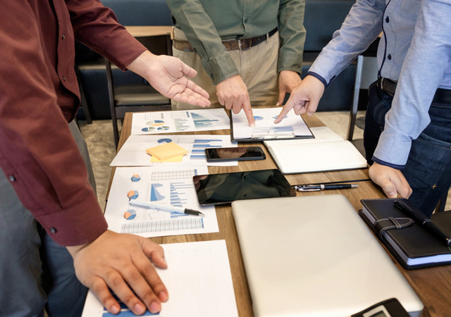Team discussing charts and data